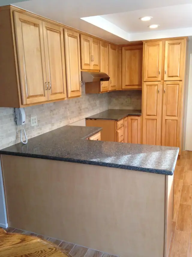 Placentia kitchen remodel with honey maple cabinets and dark countertops